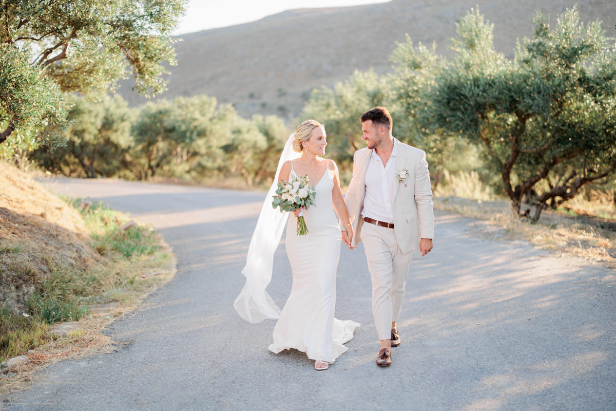 couple walking together, after their wedding in Biolea Estate in Astrikas