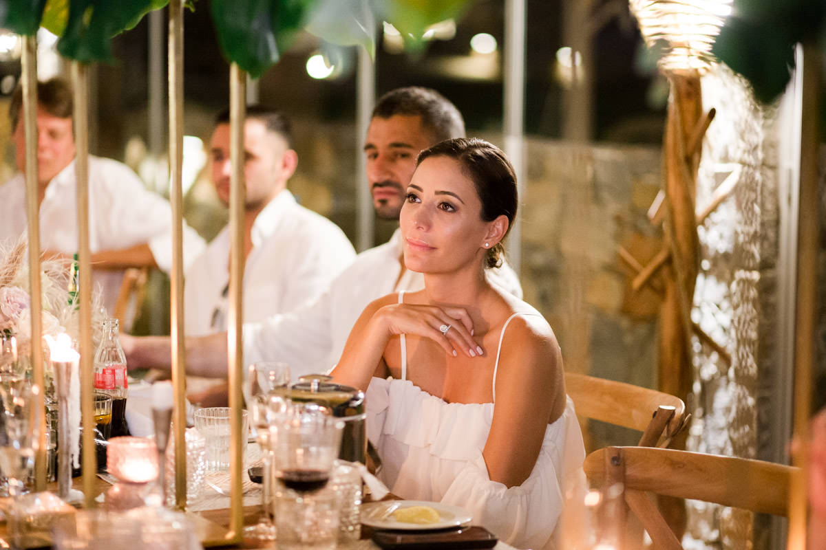 bride listening to the wedding speeches