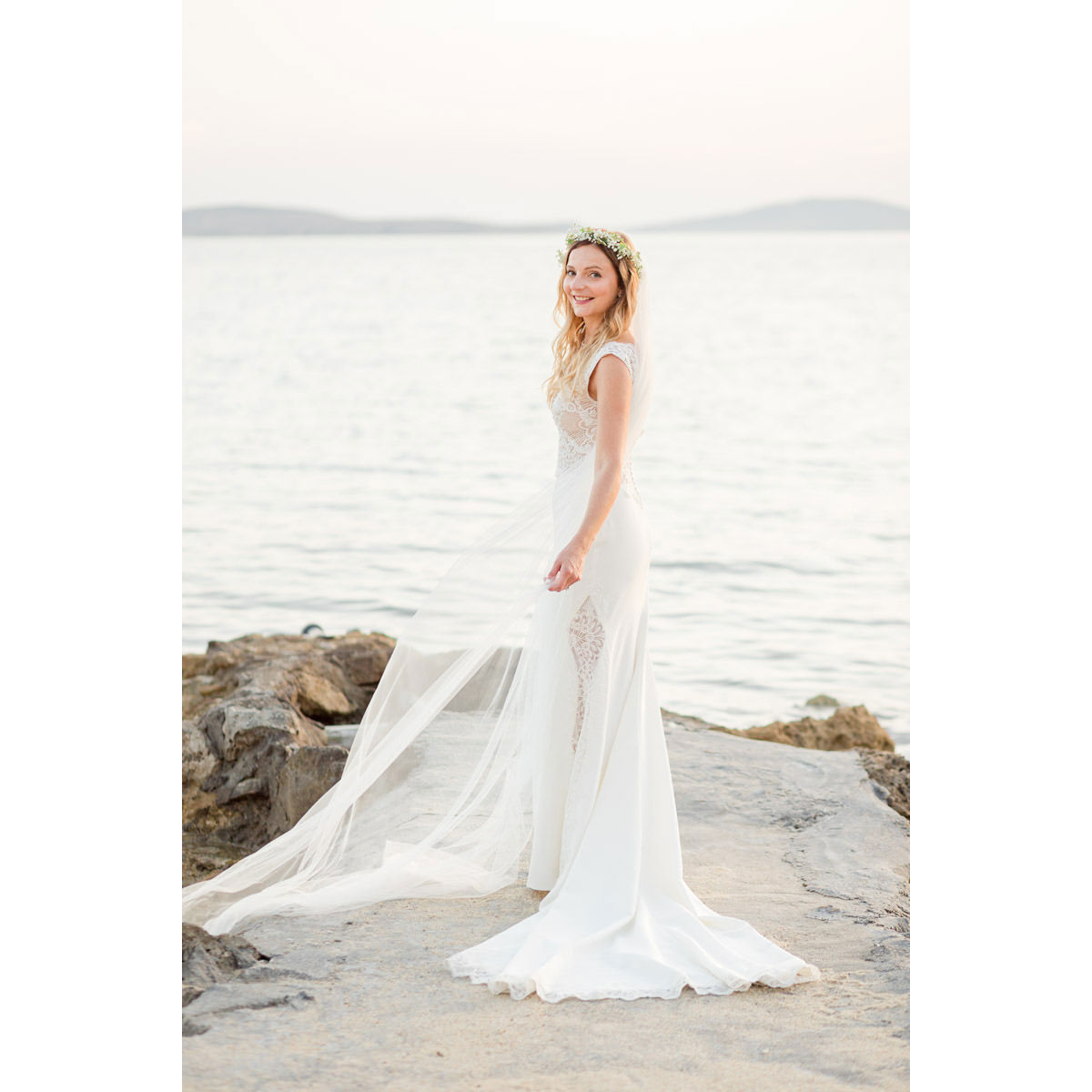 happy bride in Mykonos looking amazing by the sea