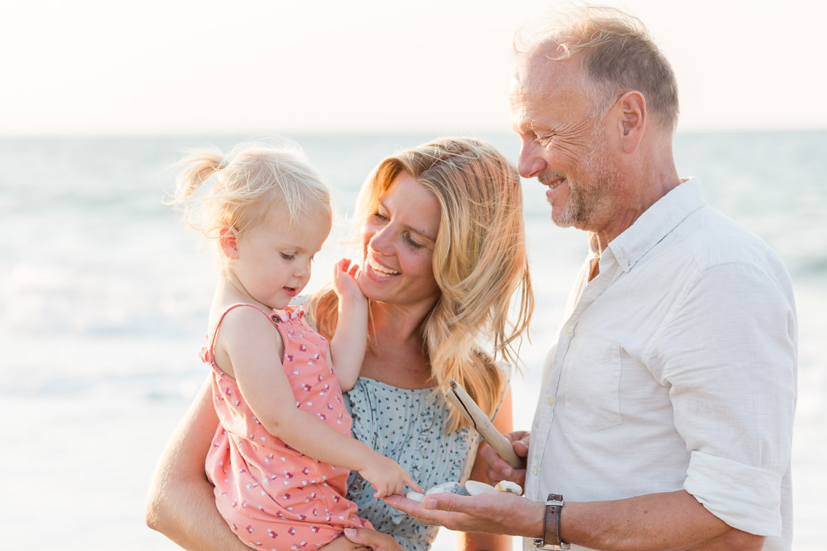 parents play with their daughter