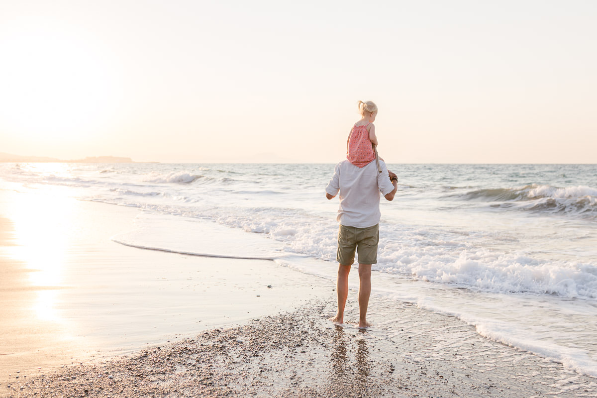 father and daughter enjoy the landscape during a photo-shoot in Greece