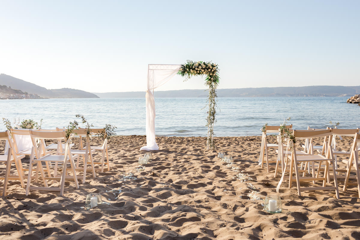 beach wedding and arch by the sea