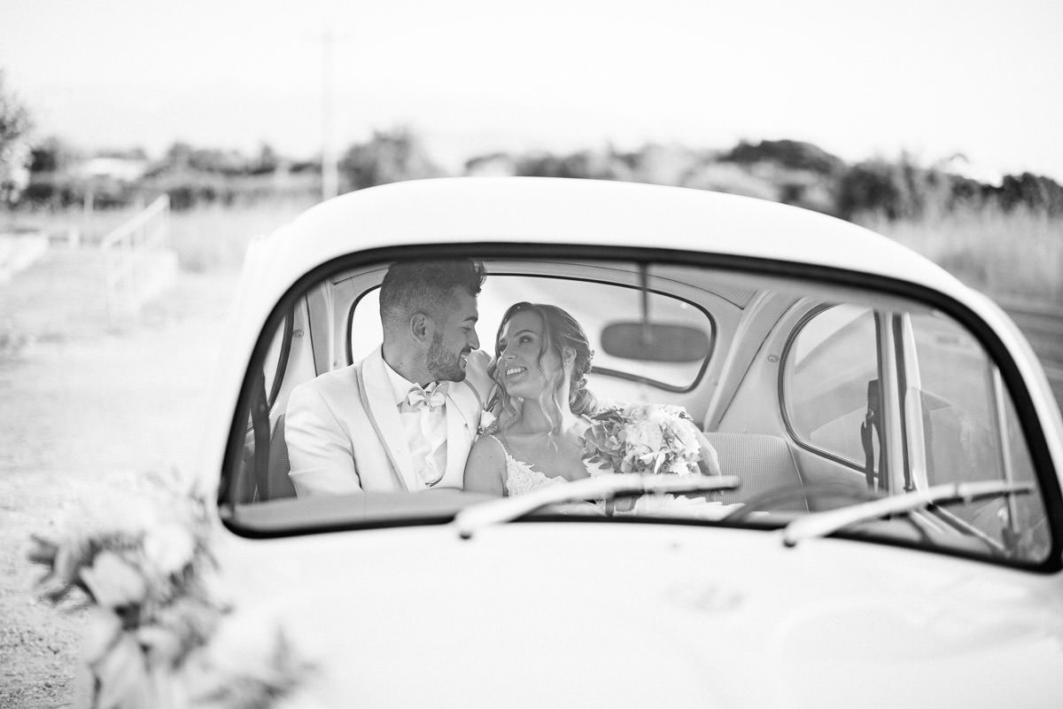 looking each other inside the wedding car