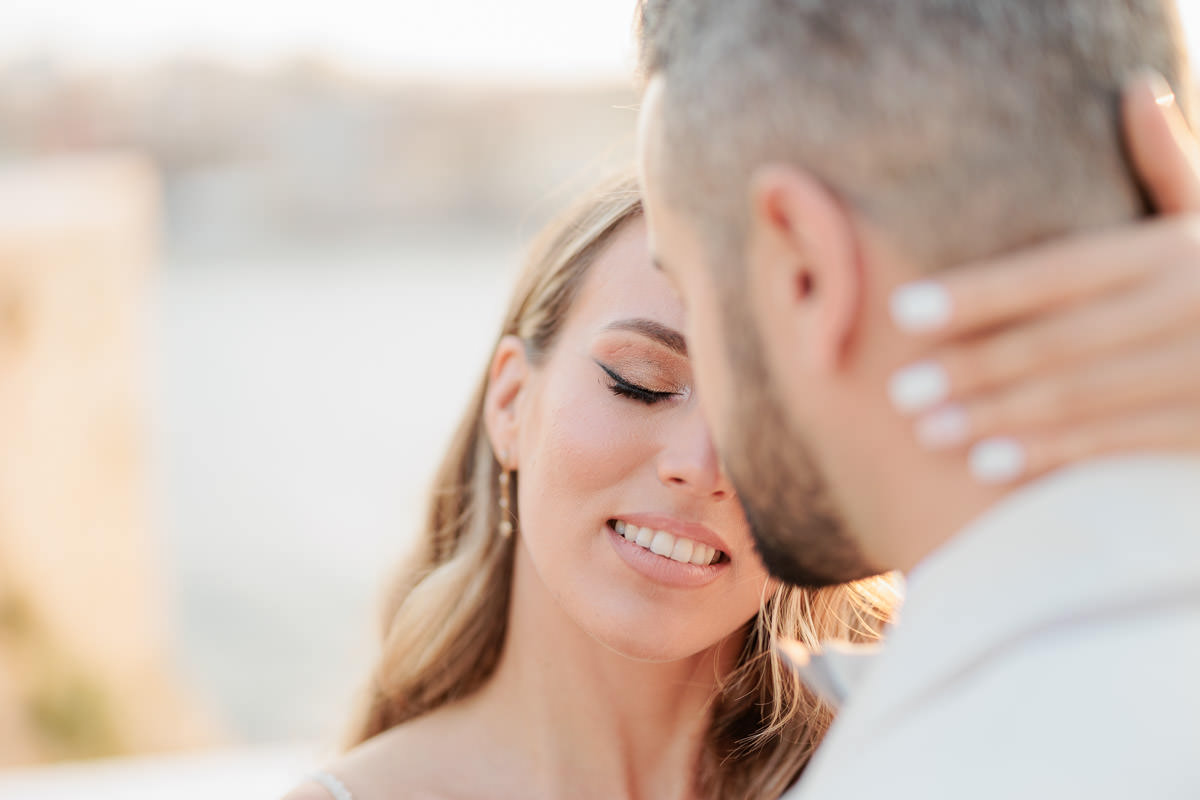 bride looking relaxed while hugging her partner