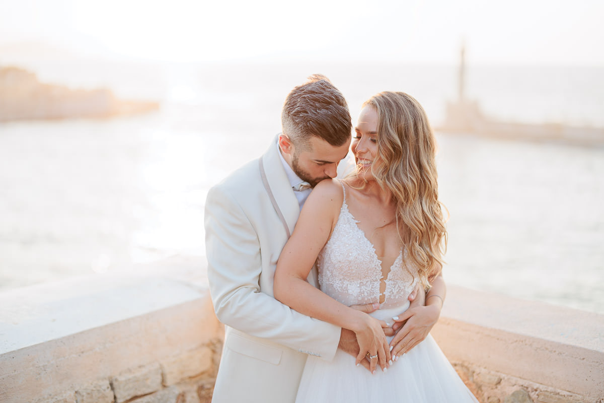 kissing bride's arm