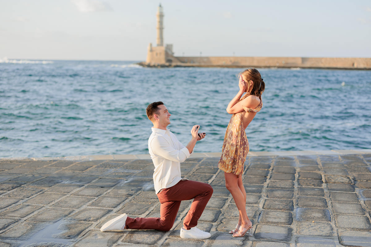 unbelievable wedding proposal in the old harbor of Chania in front of the lighthouse