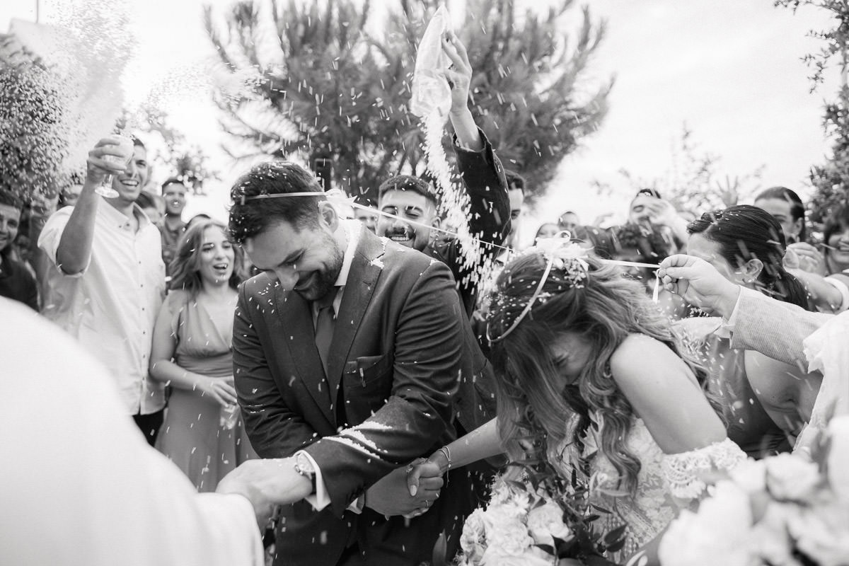 guests throw rice on the newly weds in Crete