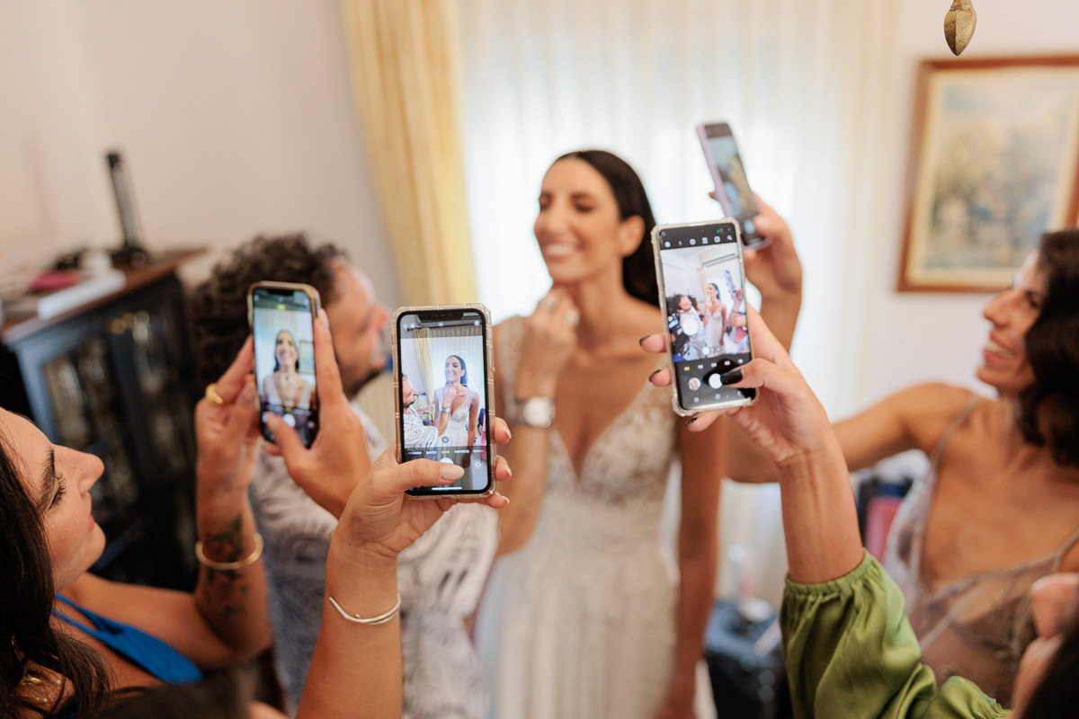 everybody takes photos of the bride