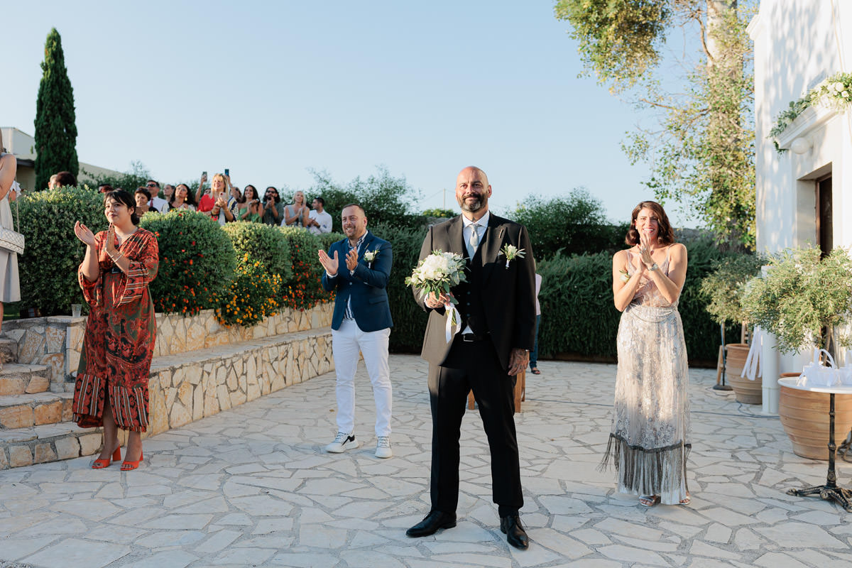 groom is waiting for bride out of the church